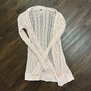 Light pink crochet sweater.